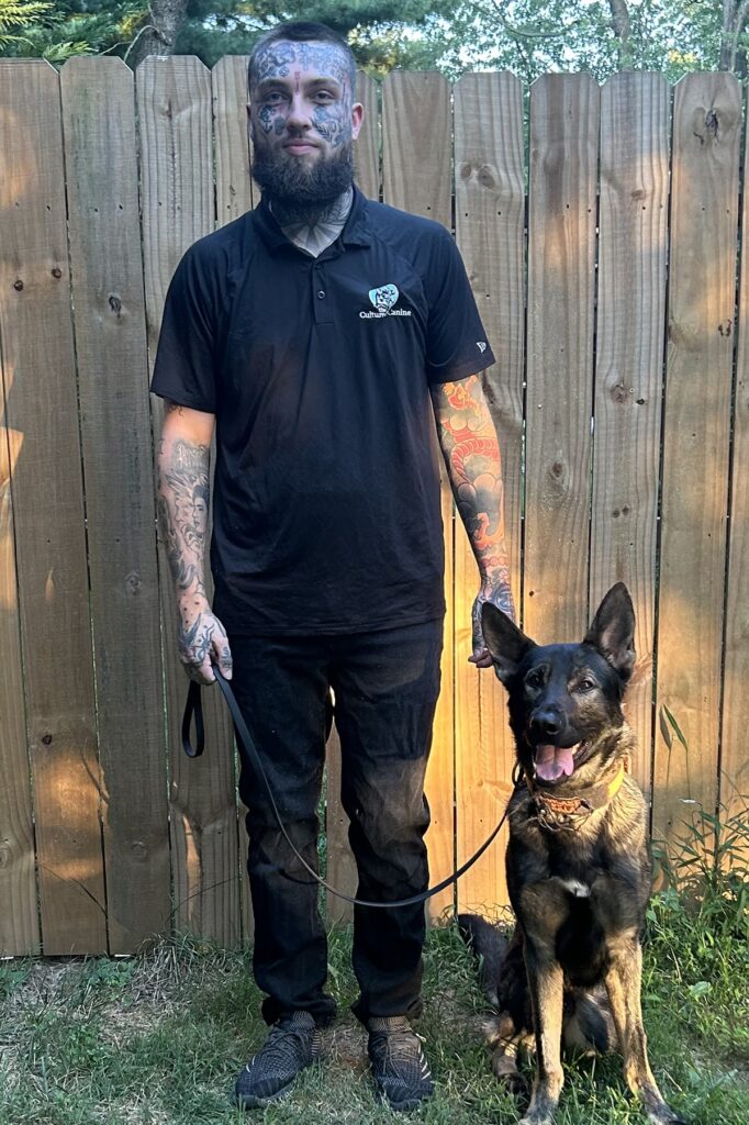 Trainer Dave from The Cultured Canine standing with a Belgian Malinois