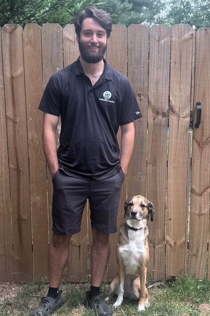 Trainer Jack from The Cultured Canine standing with a dog